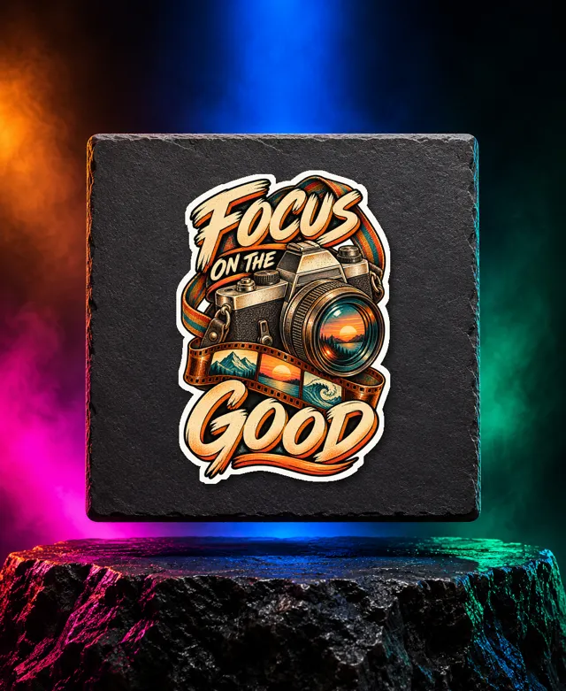 Focus on the Good sticker with a vintage camera, curved film strip and Focus on the Good lettering. White option. Digital mockup.